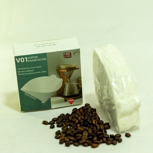 Coffee paper filters with packaging, coffee beans, and a white background